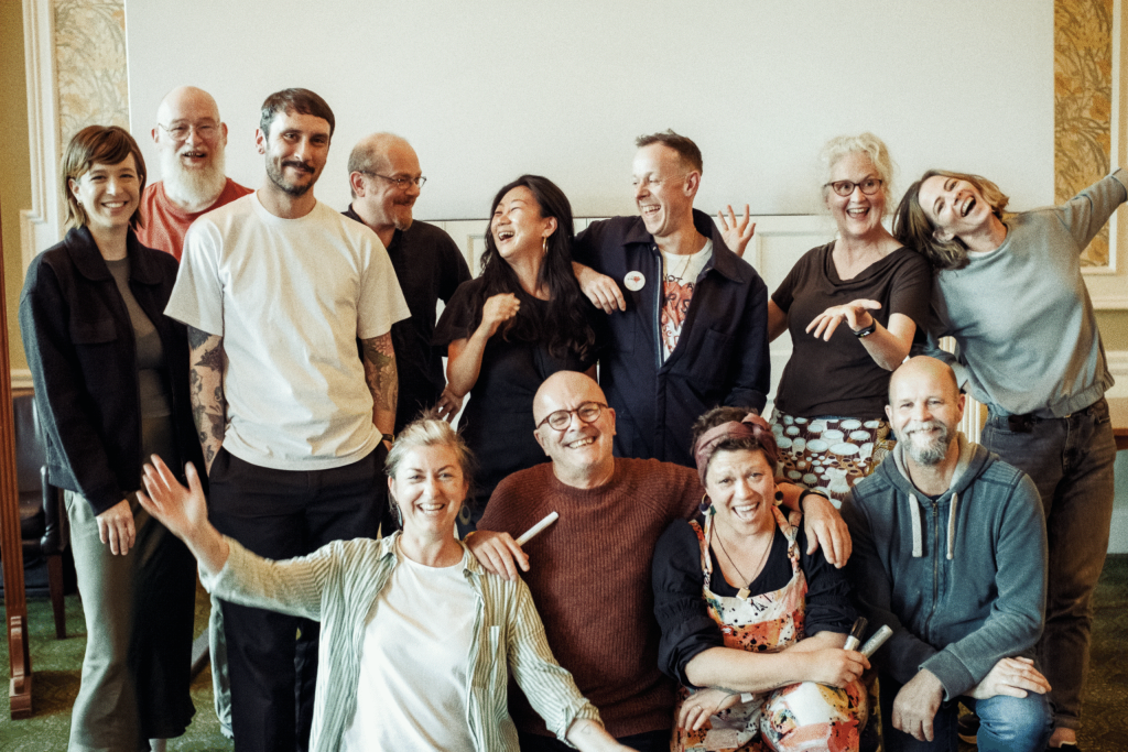 committee members smiling and posing for a group photo